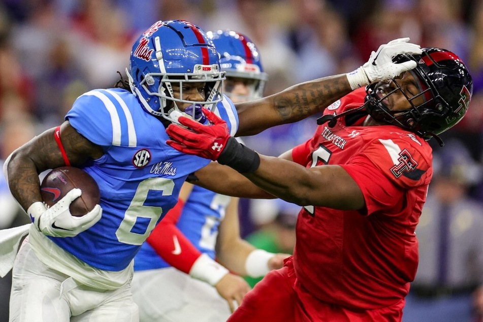 On Friday, Zach Evans (l.) declared for the NFL Draft, forgoing his final season of college football.
