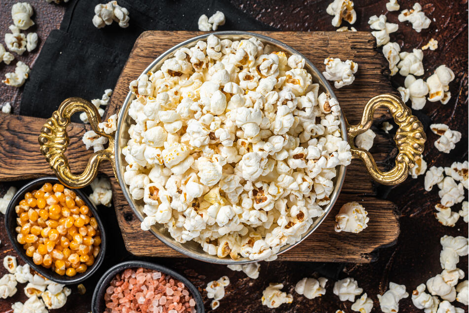 It's usually safe for dogs to eat small portions of popcorn in moderation.