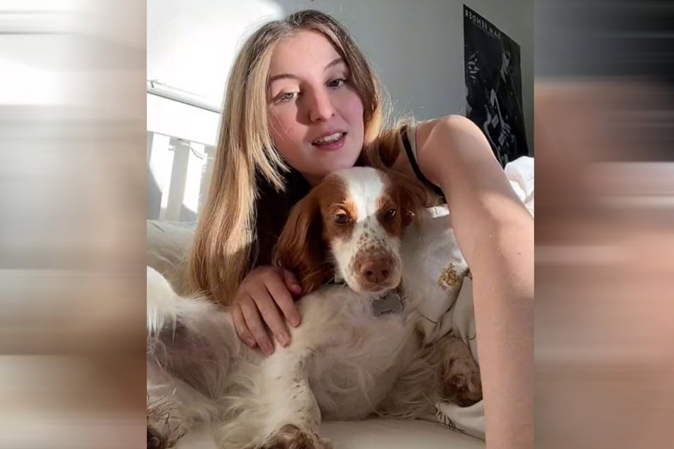 TikToker Louisa cuddles with her dog.