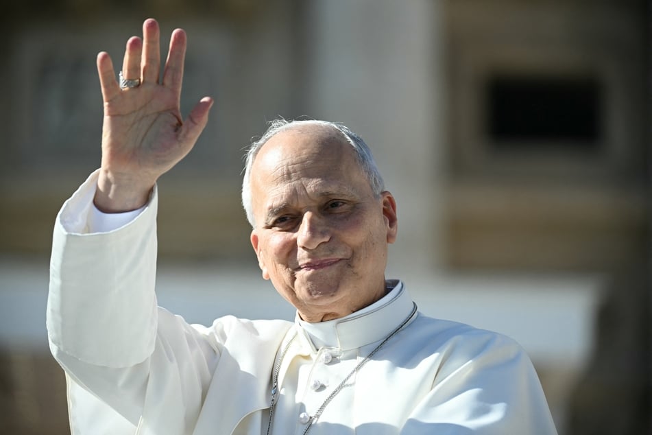 Pope Leo XIV waves to faithful as he leaves after the weekly general audience in St. Peter's Square at the Vatican on October 28, 2026. The pontiff has warned against giving AI agents legal personhood or rights.
