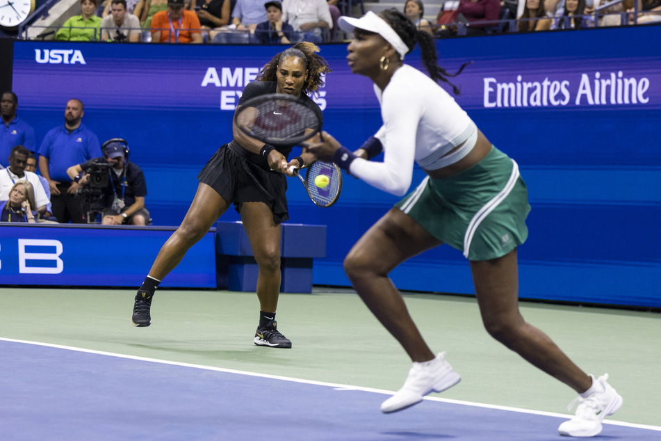 Serena (l.) and Venus Williams play against the Czech Republic's Lucie Hradecka and Linda Noskova during their 2022 US Open Tennis tournament women's doubles first-round match in New York on September 1, 2022.