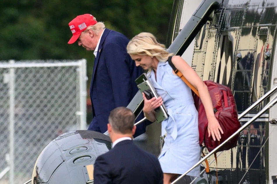 President Donald Trump and aide Natalie Harp (r) exit Marine One on the Ellipse near the White House on August 16, 2026.