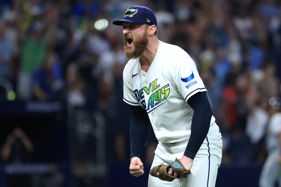 Tampa Bay Rays pitcher Bryan Baker celebrates after a win against the Cleveland Guardians in game two of the ALCS.