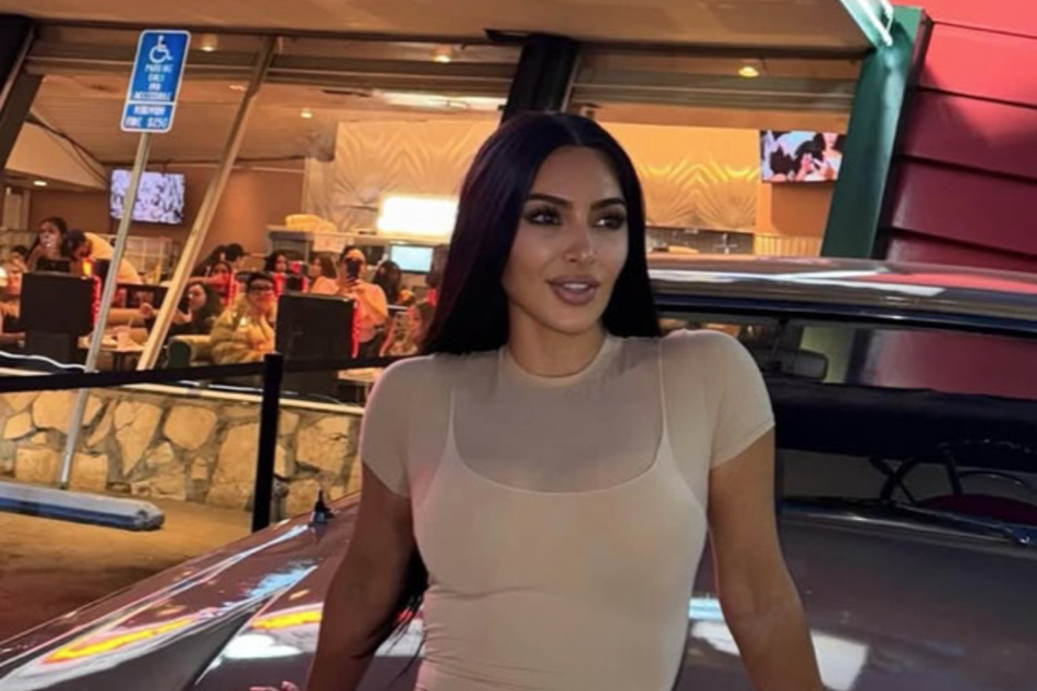 Kim Kardashian shared a suspicious snap with a handsome mystery man that fans allege could be her new boo.