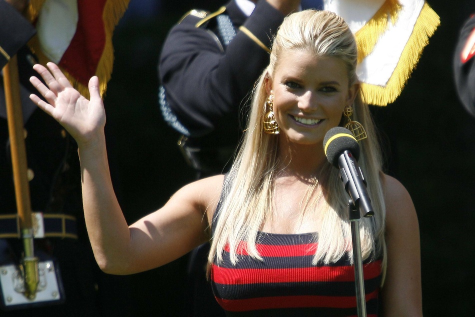 Jessica Simpson (40) singing the national anthem at the AT&T golf tournament in 2009.