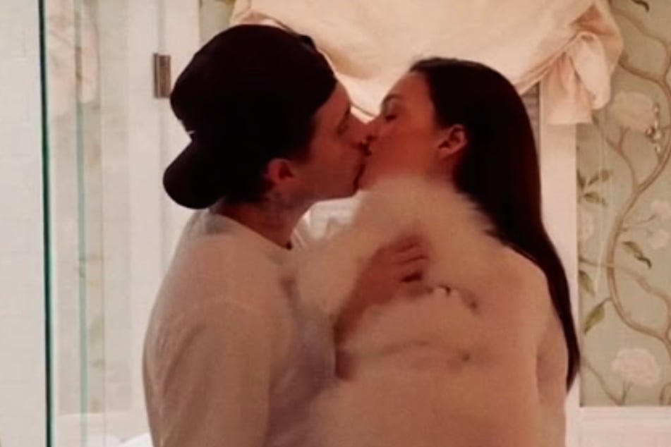 Brooklyn Beckham (l.) and Nicola Peltz packed on the PDA in a romantic slideshow amid the 26-year-old's family drama.