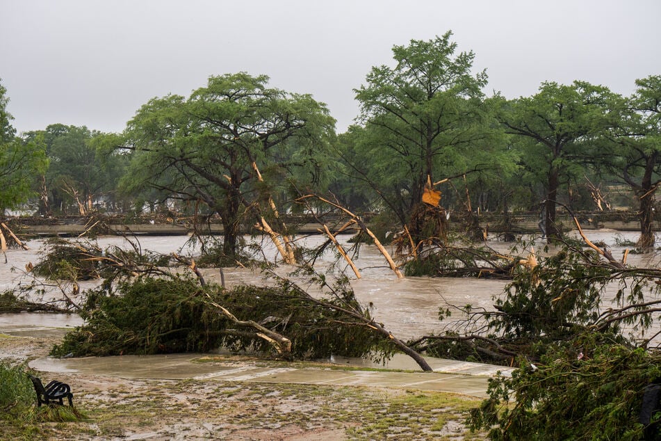Trees emerge from flood waters along the Guadalupe River on Friday in Kerrville, Texas. Heavy rainfall caused flooding along the Guadalupe River in central Texas, with multiple fatalities reported.