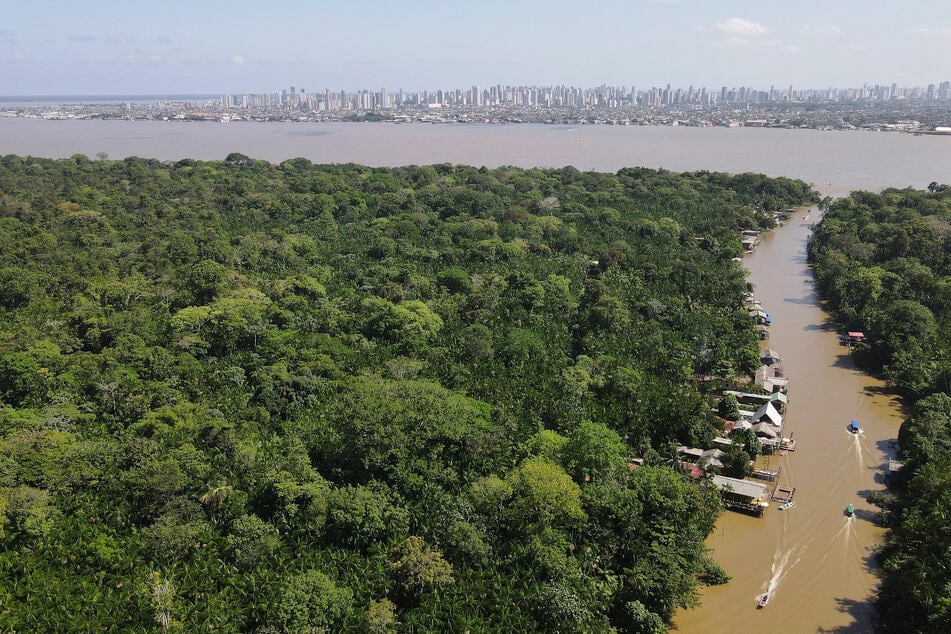 A drone image shows the Amazon rainforest and the city of Belem, Brazil, in the background ahead of COP30.