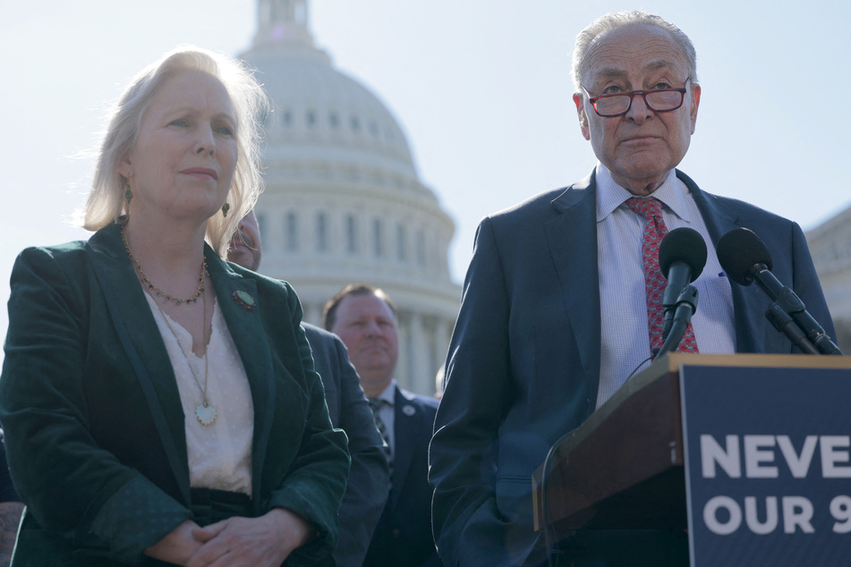 Chuck Schumer (r.) joined with first responders and 9/11 victims outside the Capitol building to rally against cuts to the WTCHP.