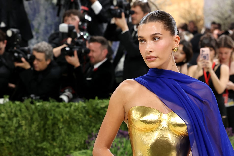 Hailey Bieber shows off new tattoo tribute to son in series of bikini snaps