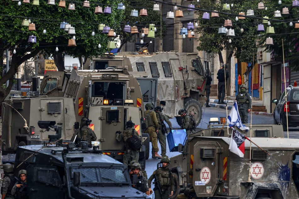 Israeli army soldiers conduct a raid in Nablus, in the occupied West Bank, on July 26, 2026.