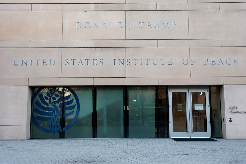 President Donald Trump's name now appears on the outside of the United States Institute of Peace headquarters building.