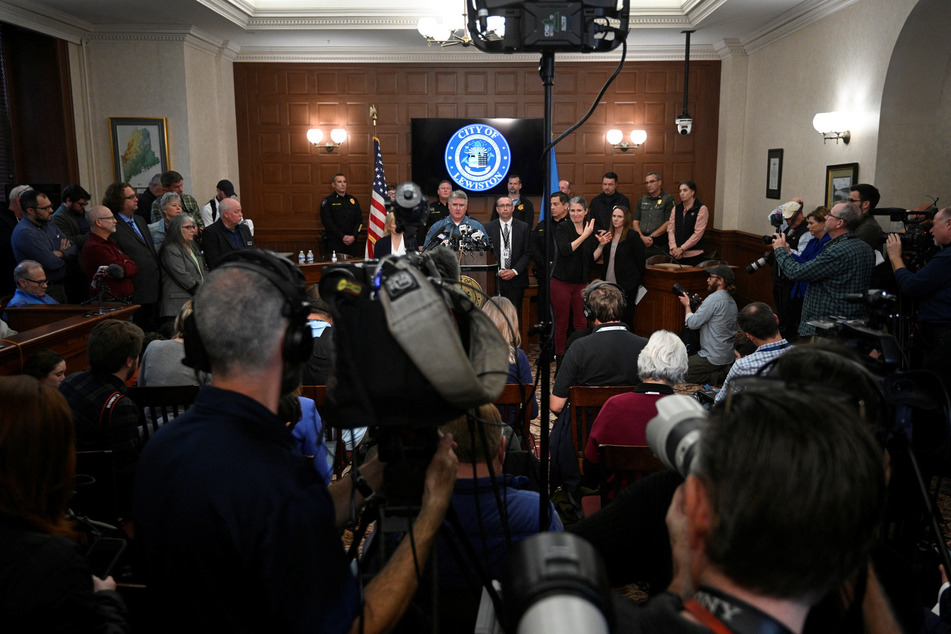 Authorities hold a press conference amid an ongoing manhunt for Card.