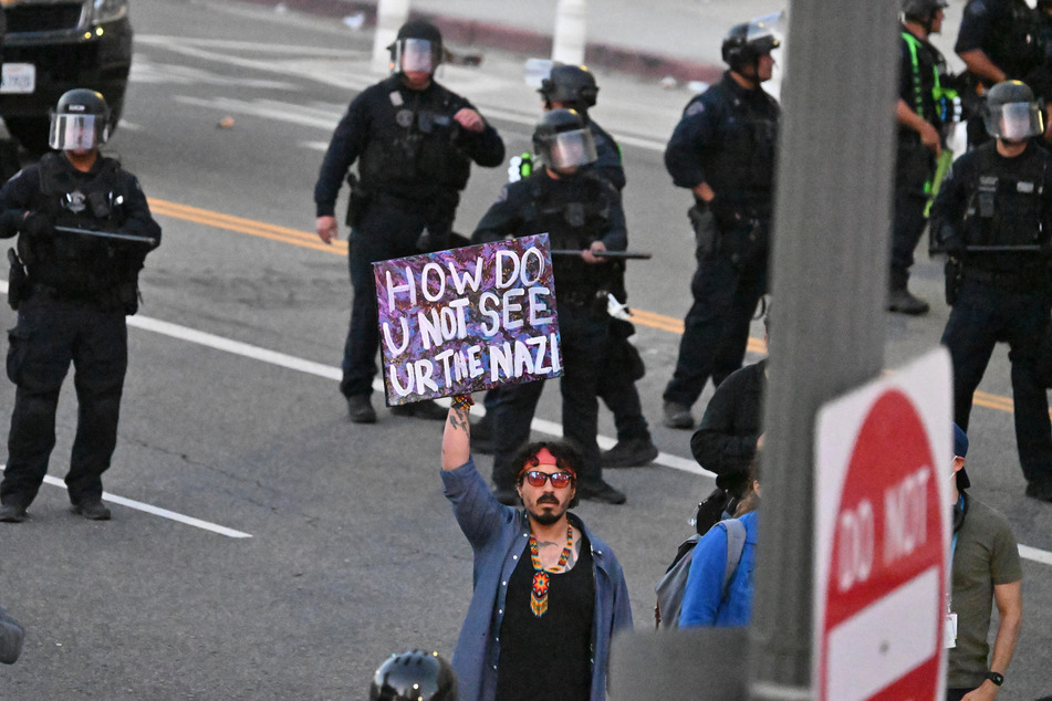 LA police said it conducted mass arrests after the city's mayor imposed a curfew to crack down on widespread protests against attacks on immigrant communities.