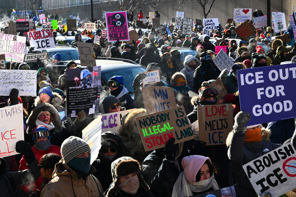 Demonstrators participate in a rally and march during an "ICE Out” day of protest on Friday in Minneapolis, Minnesota.