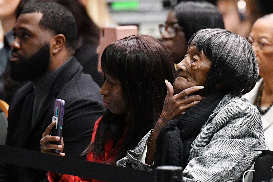 Lessie Benningfield Randle (r.) listens as then President Joe Biden speaks during a commemoration of the 100th anniversary of the Tulsa Race Massacre at the Greenwood Cultural Center on June 1, 2021.