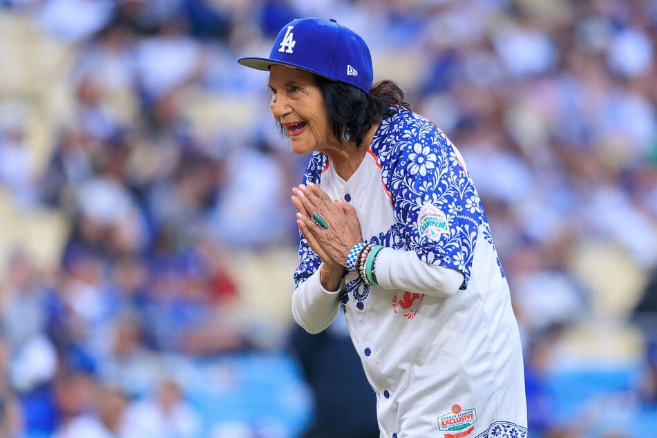 Dolores Huerta throws out the ceremonial first pitch before an MLB game between the Los Angeles Dodgers and the Colorado Rockies on May 26 in Los Angeles, California. Huerta was mourned by numerous high-profile politicians, including former Presidents Barack Obama and Bill Clinton.