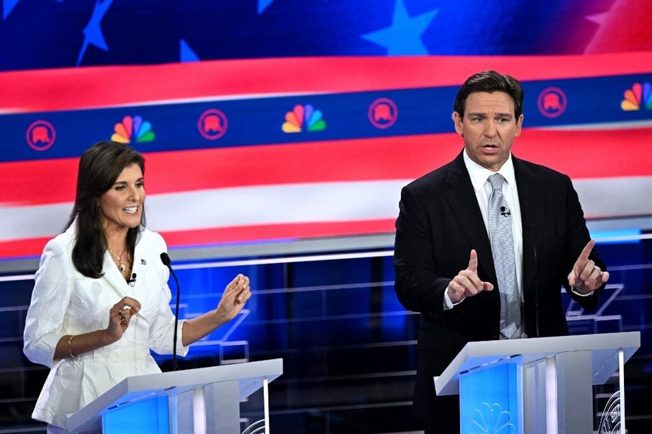 Former Governor of South Carolina and United Nations ambassador Nikki Haley (l.) and Florida Governor Ron DeSantis speak during the third Republican presidential primary debate.