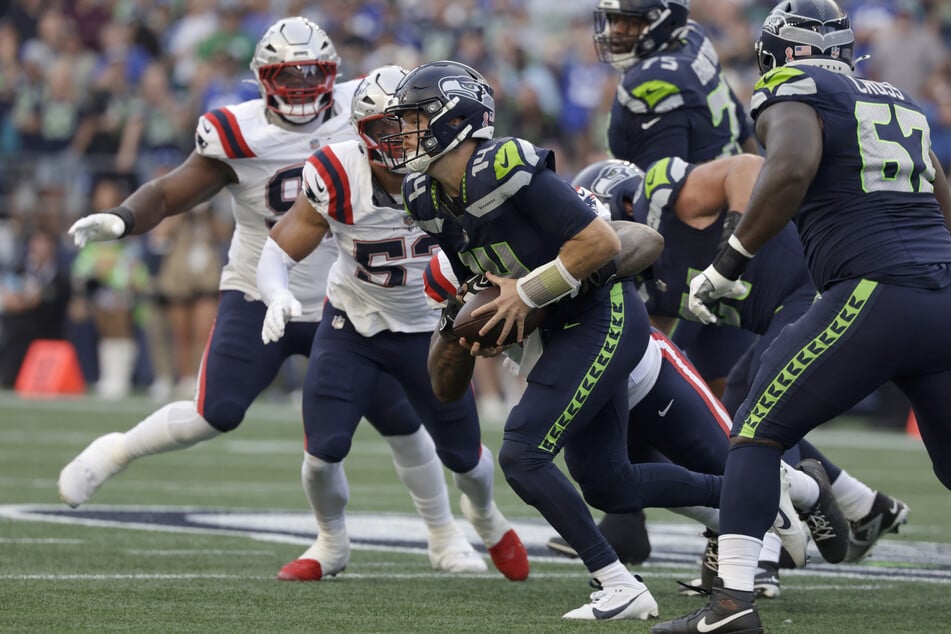 New England Patriots defensive end Dre'Mont Jones sacks Seattle Seahawks quarterback Sam Darnold during the first quarter at Lumen Field.