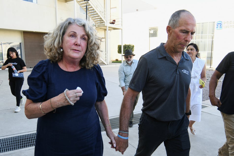 Martin and Debra Robinson, parents of Australian brothers Callum and Jake Robinson, leave the Baja California State Palace of Justice after a Mexican judge announced guilty verdicts on October 9, 2026.