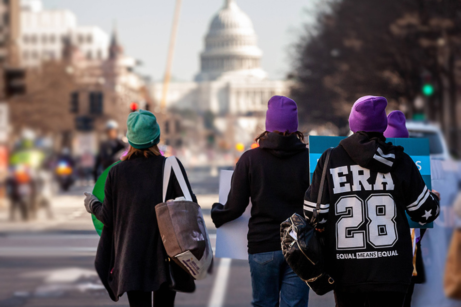 Equal Rights Amendment Protesters march to the Department of Justice to demand action.