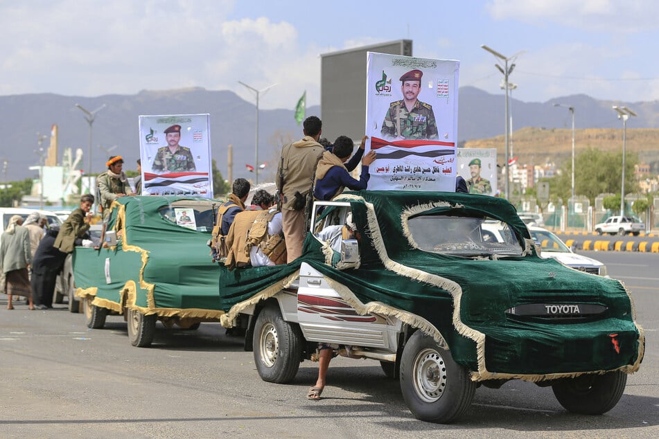 Houthi forces hold the portrait of a fighter killed in recent fighting during his funeral in the Yemeni capital of Sanaa, which has been under constant Saudi Arabian bombardment over recent weeks.