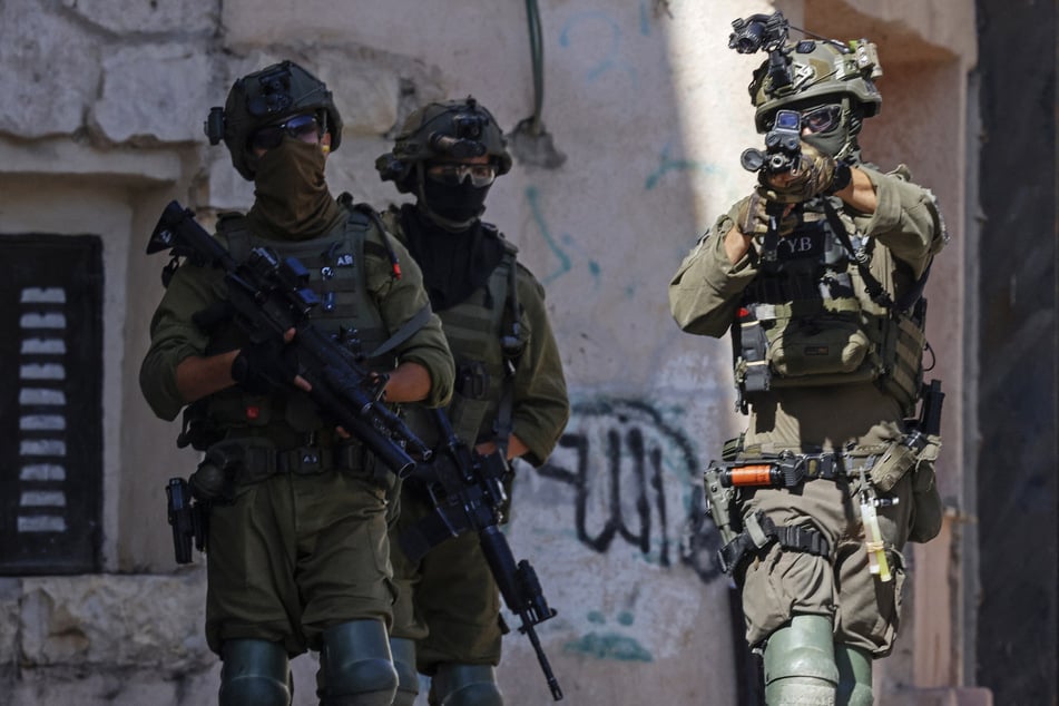Israeli soldiers conduct a raid in the Palestinian village of Biddu, northwest of Jerusalem, on September 21, 2026.