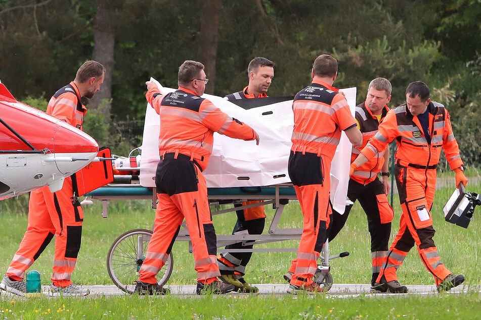 Picture taken on Wednesday shows Slovak Prime Minister Robert Fico being transported from a helicopter by medics to the hospital in Banska Bystrica, Slovakia for treatment after he had been shot "multiple times."