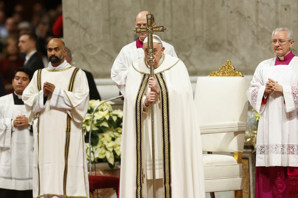 Pope Francis celebrates Christmas Eve mass in St. Peter's Basilica at the Vatican on December 24, 2023.