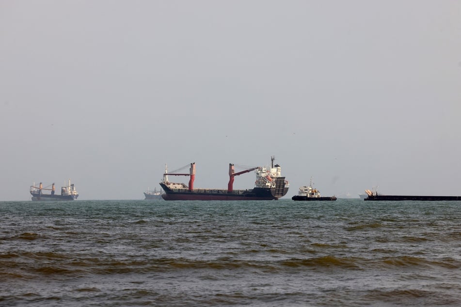 Vessels are seen in the Strait of Hormuz, off the port city of Bandar Abbas in southern Iran on Monday.