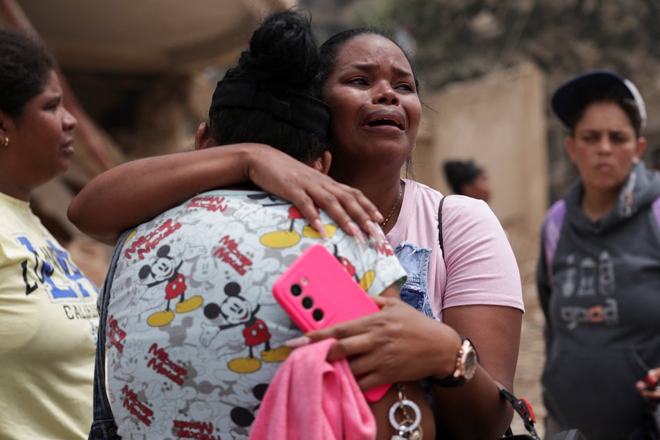 A woman reacts as she thinks a family member is trapped in the rubble in La Guaira, Venezuela, after earthquakes hit the country, on June 25, 2026.
