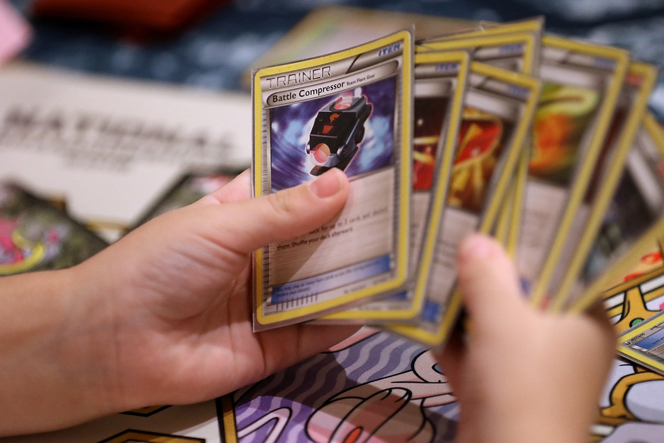 Thieves made out with $100,000 worth of Pokémon cards in a gunpoint robbery at New York's Poke Court shop.