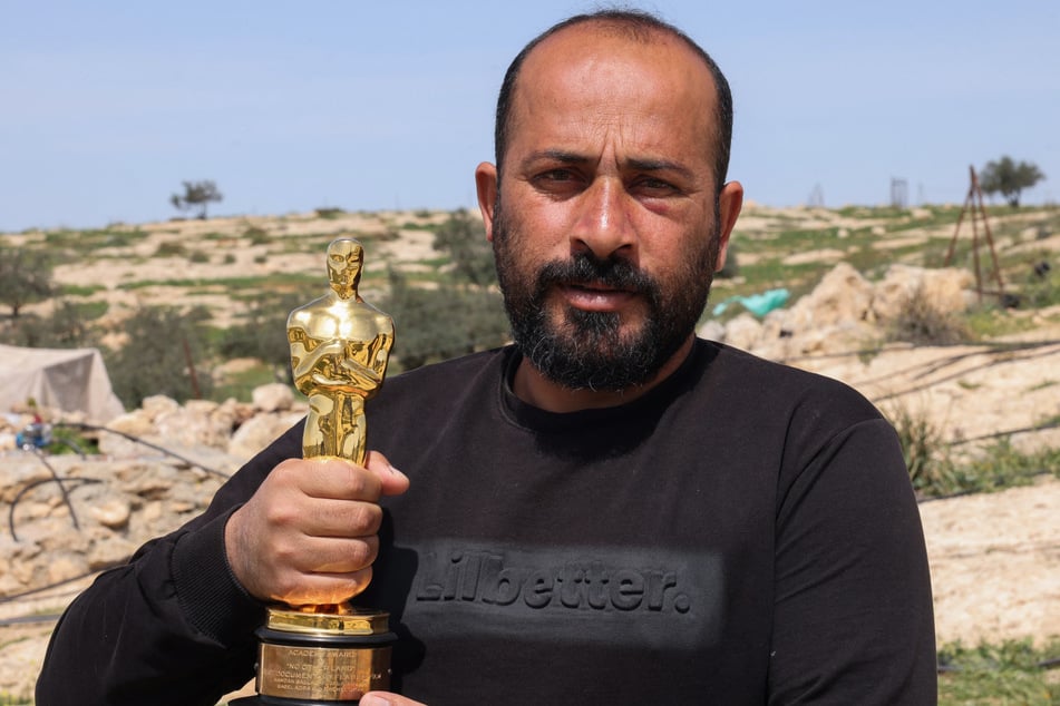 Oscar-winning Palestinian filmmaker Hamdan Ballal said Wednesday that he was attacked by Israeli settlers for winning the prestigious award, calling the "brutality" life-threatening.