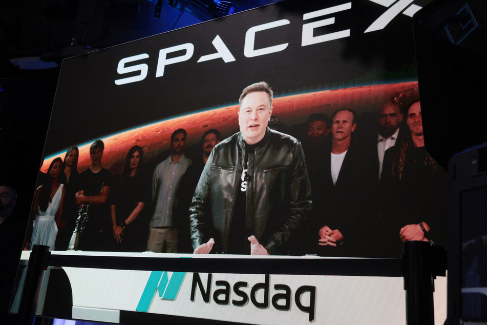 Elon Musk, founder and CEO of SpaceX, speaks via video before the ringing of the opening bell at the Nasdaq Marketsite at the launch of the company's initial public offering (IPO) on Friday.