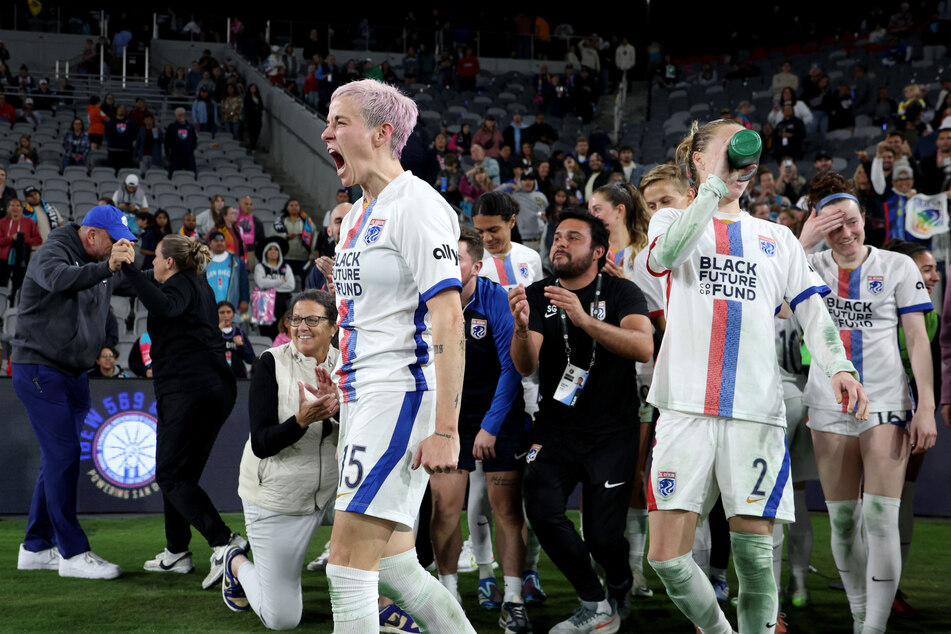 Megan Rapinoe (no. 15) celebrates after the OL Reign's 1-0 win over the San Diego Wave in the NWSL playoff semifinals.