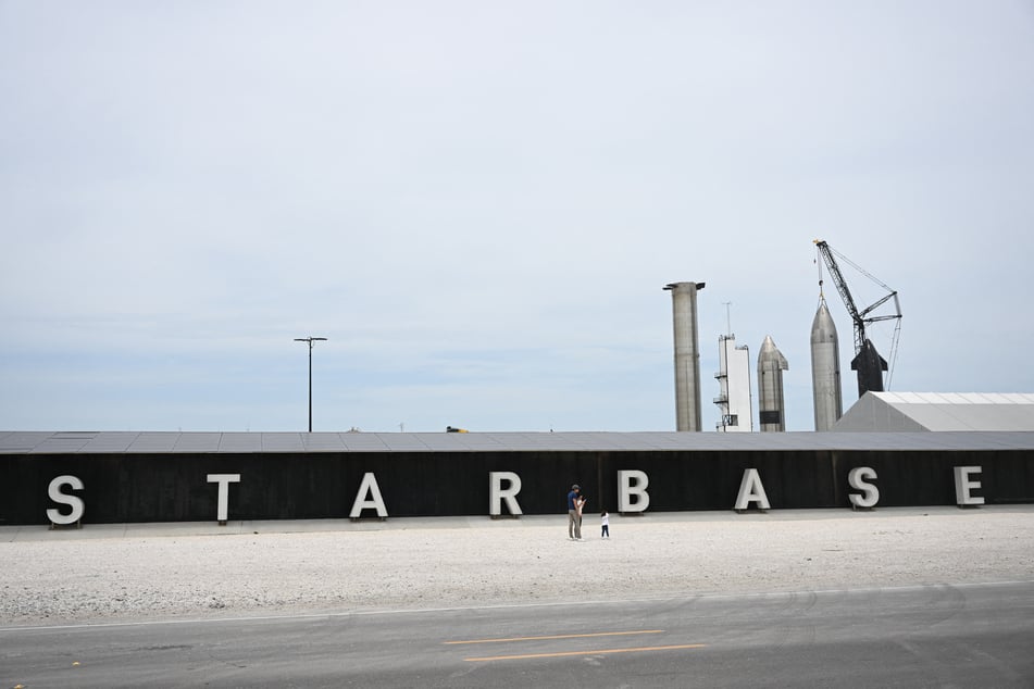 People take pictures of the rocket garden ahead of the SpaceX Starship flight test from Starbase in Boca Chica, Texas.