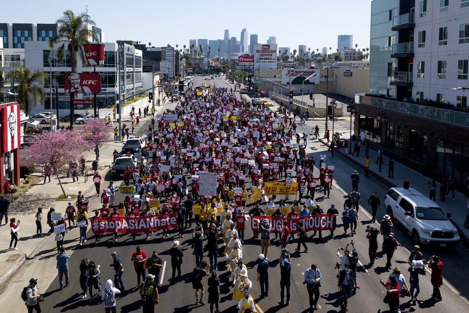Hundreds of demonstrators gathered in Koreatown for a unity rally and march down Olympic Boulevard in Los Angeles.