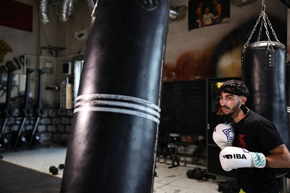 First Palestinian Olympic boxer fights challenges of Israeli occupation before making history