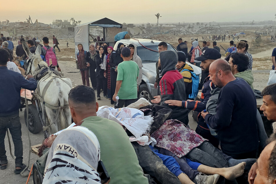 Israeli forces killed dozens of Palestinians after opening fire on starving people waiting for aid at a US-backed distribution center, local authorities said.