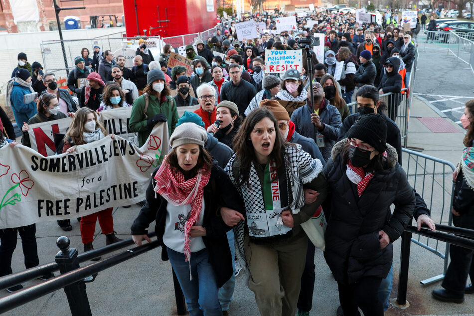 Demonstrators in Somerville, Massachusetts, take part in a rally in support of Rümeysa Öztürk after she was taken into custody by federal agents.
