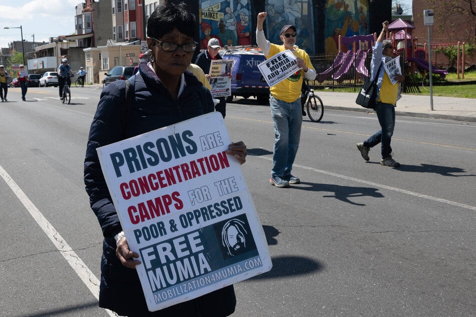 Demonstrators march for imprisoned political prisoner Mumia Abu-Jamal during a protest in Philadelphia, Pennsylvania, on April 23, 2023.