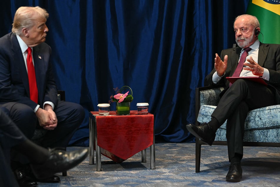Brazil's President Luiz Inacio Lula da Silva (r.) talks to US President Donald Trump during a bilateral meeting on the sidelines of the 47th ASEAN Summit in Kuala Lumpur on October 26, 2025.