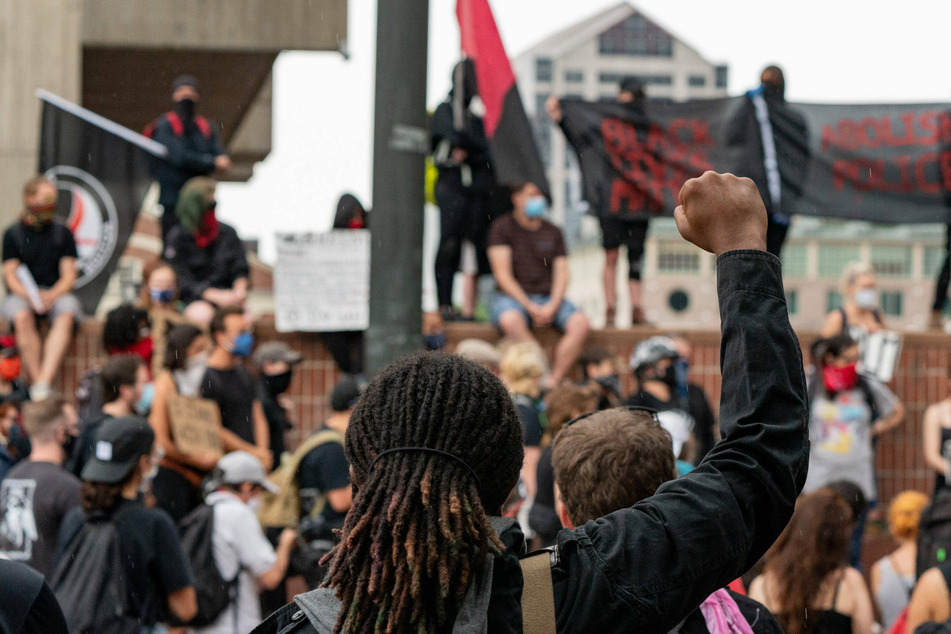 Protesters gather at a Black Lives Matter rally at Boston City Plaza.