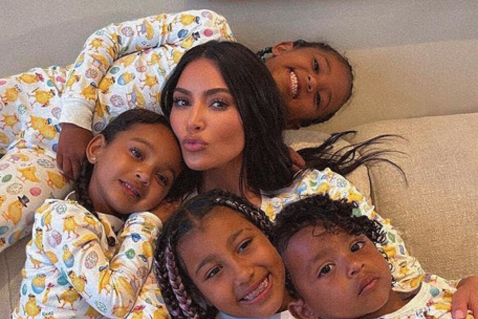 Kim Kardashian (m.) had her hands full on Tuesday when her two boys caused a bit of a commotion during her a recent interview.