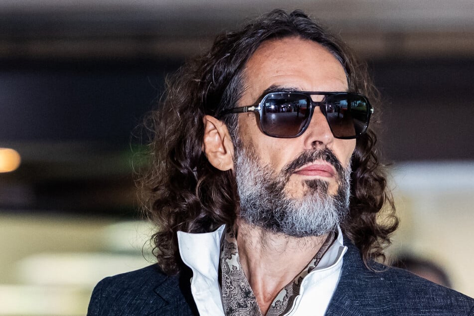 Russell Brand leaves after jury selection finishes at the start of his trial at Southwark Crown Court in London on Monday. Brand has pleaded not guilty to the charges against him.