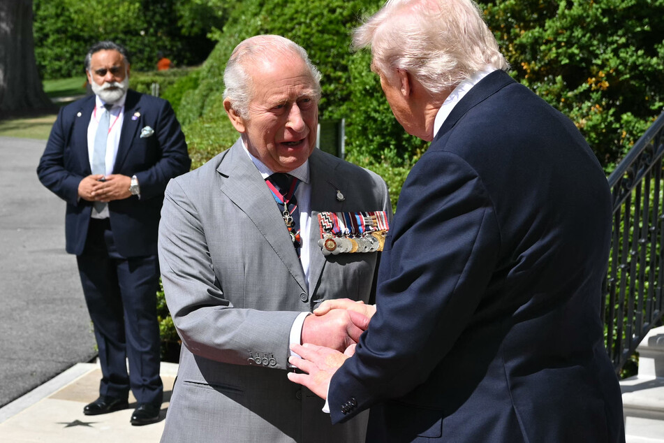 King Charles III (l) is greeted by President Donald Trump (r) during a state visit to Washington, DC, on April 30, 2026.