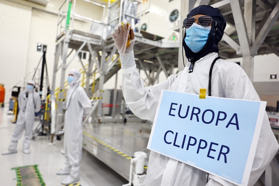 NASA's Clipper spacecraft is scheduled to investigate and perform flybys of Europa, Jupiter's moon, where data suggests a global ocean of water lies beneath the icy surface which may be habitable for life.