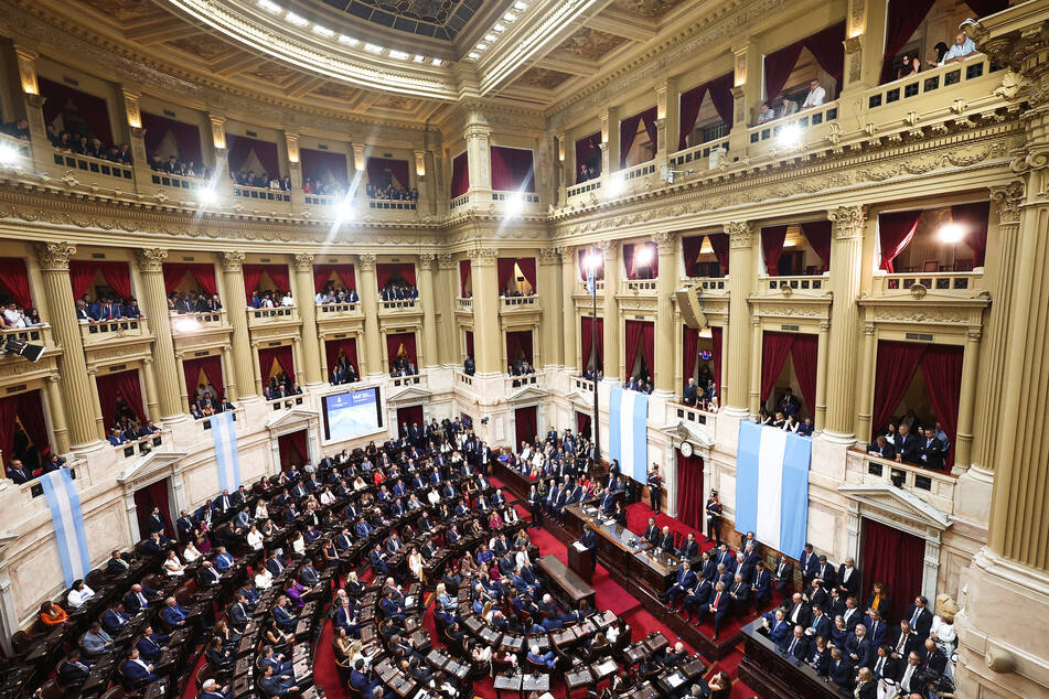 Lawmakers listen as Argentina's President Javier Milei speaks at the National Congress building in Buenos Aires on March 1, 2026.