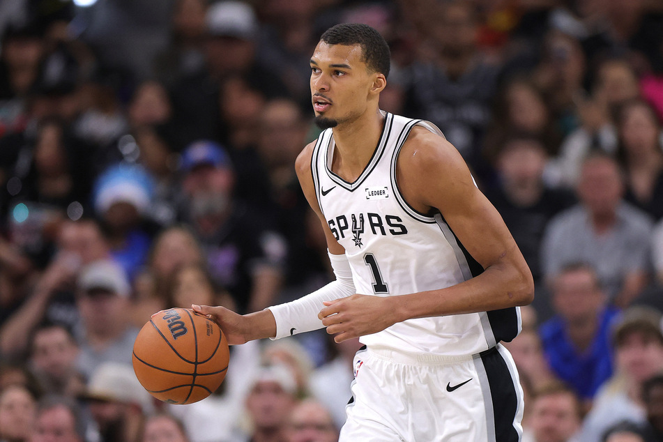 Victor Wembanyama of the San Antonio Spurs handles the ball against the Oklahoma City Thunder during the third quarter in Game Four of the NBA Western Conference Finals at Frost Bank Center on May 24, 2026.