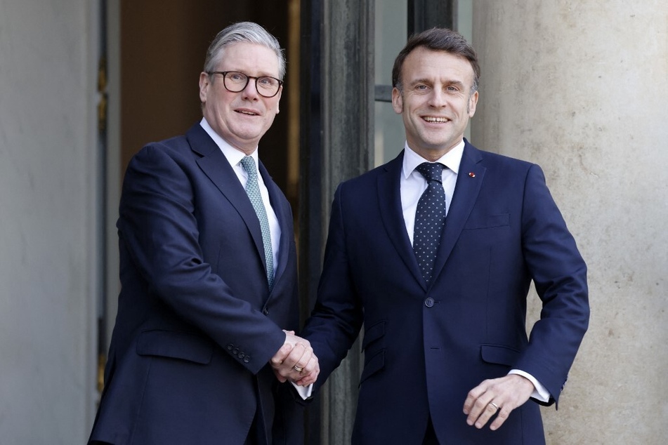 France's President Emmanuel Macron (r.) welcomes Britain's Prime Minister Keir Starmer before an informal summit of European leaders to discuss the situation in Ukraine and European security at The Elysee Presidential Palace in Paris on February 17, 2025.